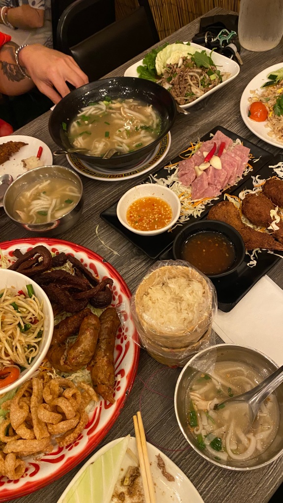 food spread, lunar new year dinner, laotian dinner, salad, fried riced, udon soup, papaya salad, sticky rice